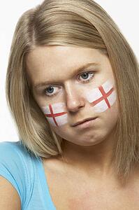 Sad Young Female Sports Fan With St Georges Flag Painted On Face