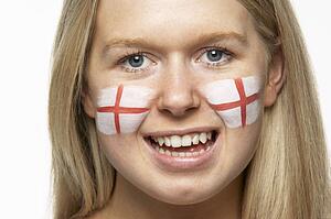 Young Female Sports Fan With St Georges Flag Painted On Face