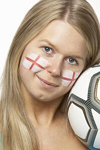 Young Female Football Fan With St Georges Flag Painted On Face