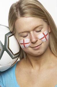 Young Female Football Fan With St Georges Flag Painted On Face