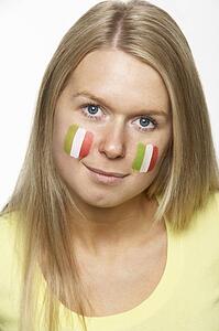 Young Female Sports Fan With Italian Flag Painted On Face