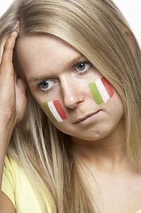 Disappointed Young Female Sports Fan With Italian Flag Painted On Face