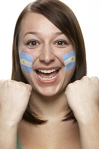 Young Female Sports Fan With Argentinian Flag Painted On Face