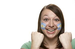 Young Female Sports Fan With Argentinian Flag Painted On Face