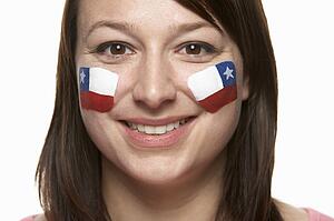 Young Female Sports Fan With Chilean Flag Painted On Face