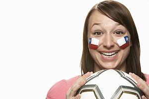 Young Female Football Fan With Chilean Flag Painted On Face