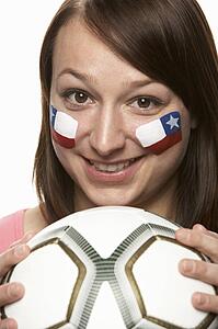 Young Female Football Fan With Chilean Flag Painted On Face