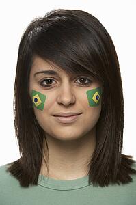Young Female Sports Fan With Brazilian Flag Painted On Face