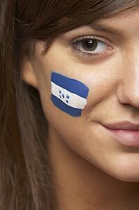 Young Female Sports Fan With Honduran Flag Painted On Face