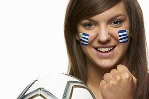 Young Female Football Fan With Uruguayan Flag Painted On Face