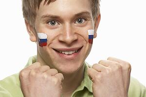 Young Male Sports Fan With Slovakian Flag Painted On Face