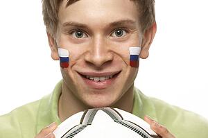 Young Male Football Fan With Slovakian Flag Painted On Face