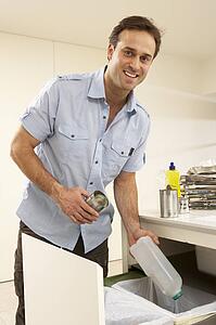 Man Recyling Waste At Home