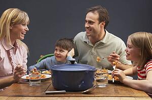 Family Enjoying Meal Together At Home
