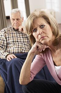 Senior Woman Caring For Sick Husband