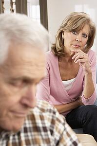 Senior Woman Caring For Sick Husband