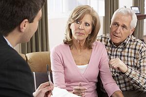 Senior Couple Talking With Financial Advisor
