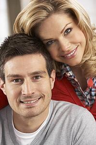 Portrait Of Happy Young Couple At Home