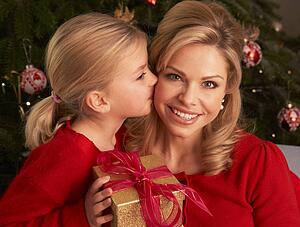 Daughter Giving Mother Christmas Gift