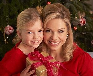Daughter Giving Mother Christmas Gift