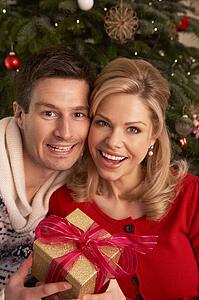 Couple Exchanging Christmas Gifts
