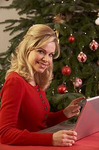 Woman Shopping Online For Christmas Gifts