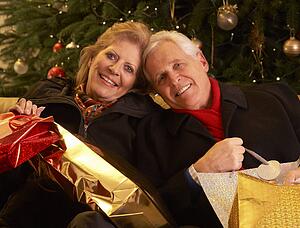 Senior Couple Returning After Christmas Shopping Trip