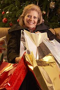 Senior Woman Returning After Christmas Shopping Trip