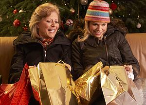 Two Women Returning After Christmas Shopping Trip