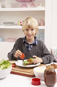 Boy Making Sandwich In Kitchen