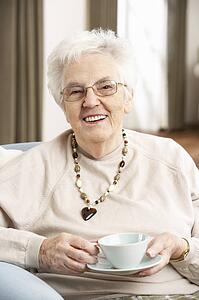Senior Woman Enjoying Cup Of Tea At Home