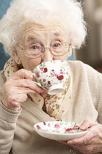 Senior Woman Enjoying Cup Of Tea At Home