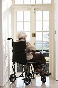 Disabled Senior Woman Sitting In Wheelchair