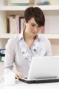 Woman Working From Home Using Laptop