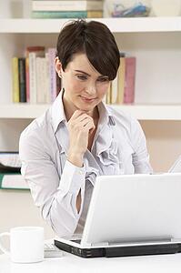 Woman Working From Home Using Laptop