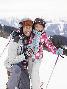 Young Father And Daughter On Ski Vacation