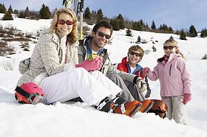 Young Family On Ski Vacation
