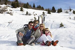 Young Family On Ski Vacation