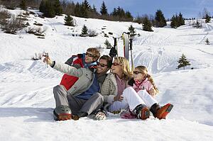 Young Family On Ski Vacation