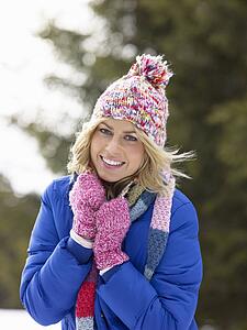 Young Woman In Alpine Snow Scene