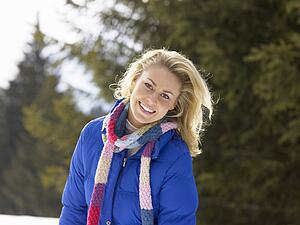Young Woman In Alpine Snow Scene