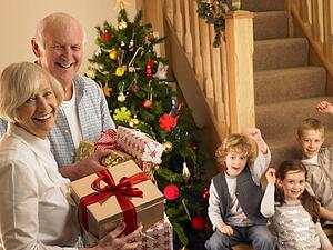 Senior couple with grandchildren at Christmas