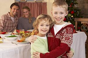 Young family at Christmas dinner table