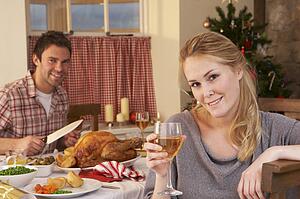 Young couple having Christmas dinner