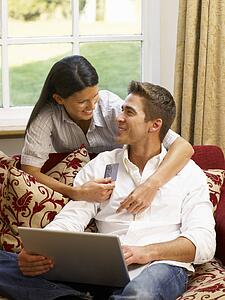 Young Hispanic couple shopping online
