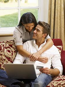 Young Hispanic couple shopping online