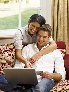 Young Hispanic couple shopping online