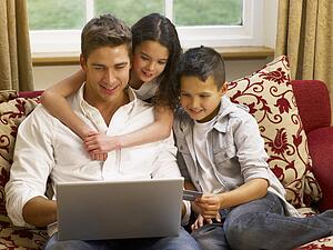 Hispanic father and children shopping online
