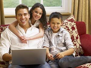 Hispanic father and children shopping online