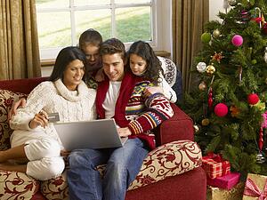 Hispanic family Christmas shopping online